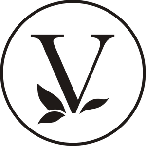 A bold, black letter V inside a thin black circle, with three stylized leaves at the base of the V on a white background.