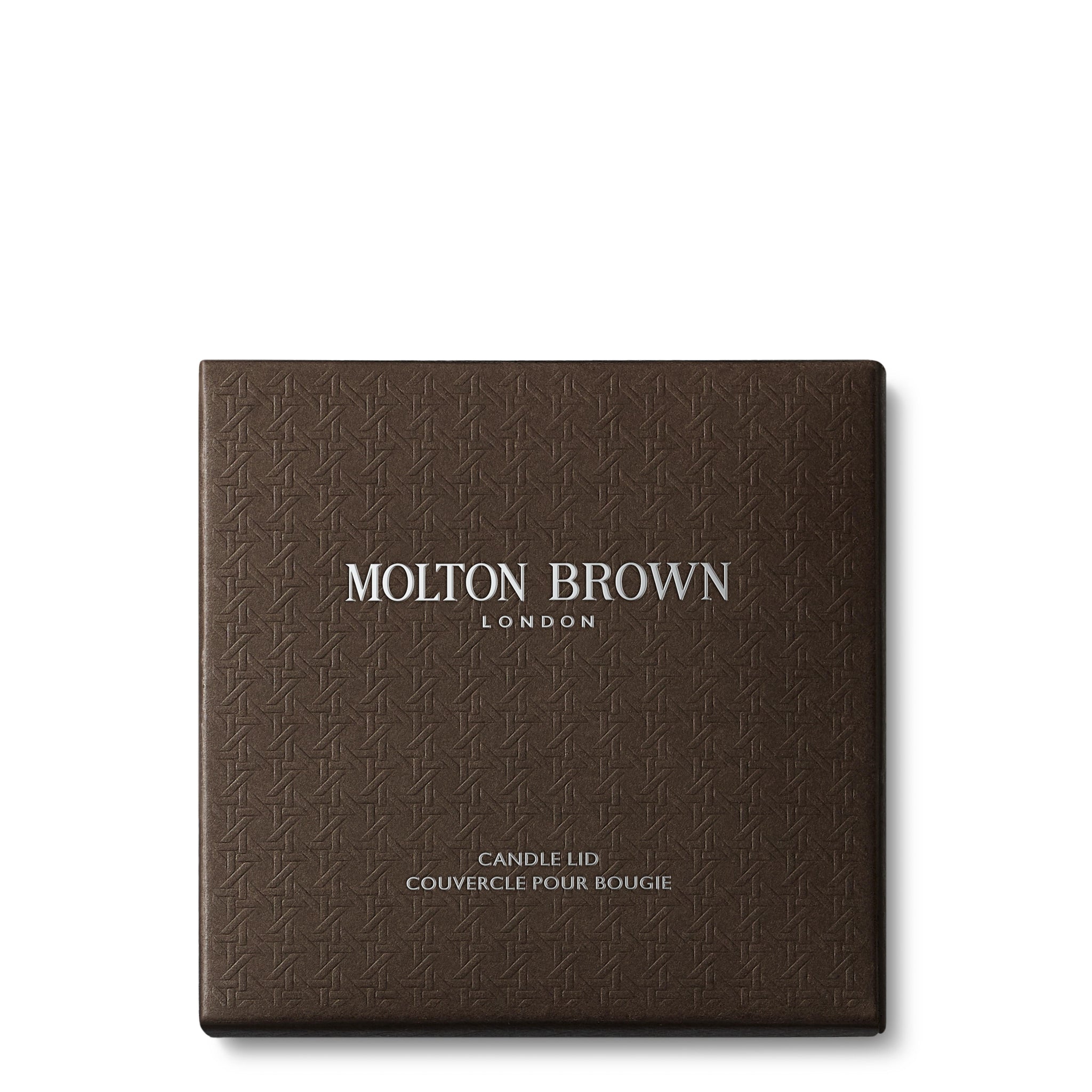 A stylish, textured brown Signature Kaars Lid 98g box from MoltonBrown Nederlands with zilveren logo, ideaal om je kaars te beschermen en het geur te behouden met de elegante kaars deksel.