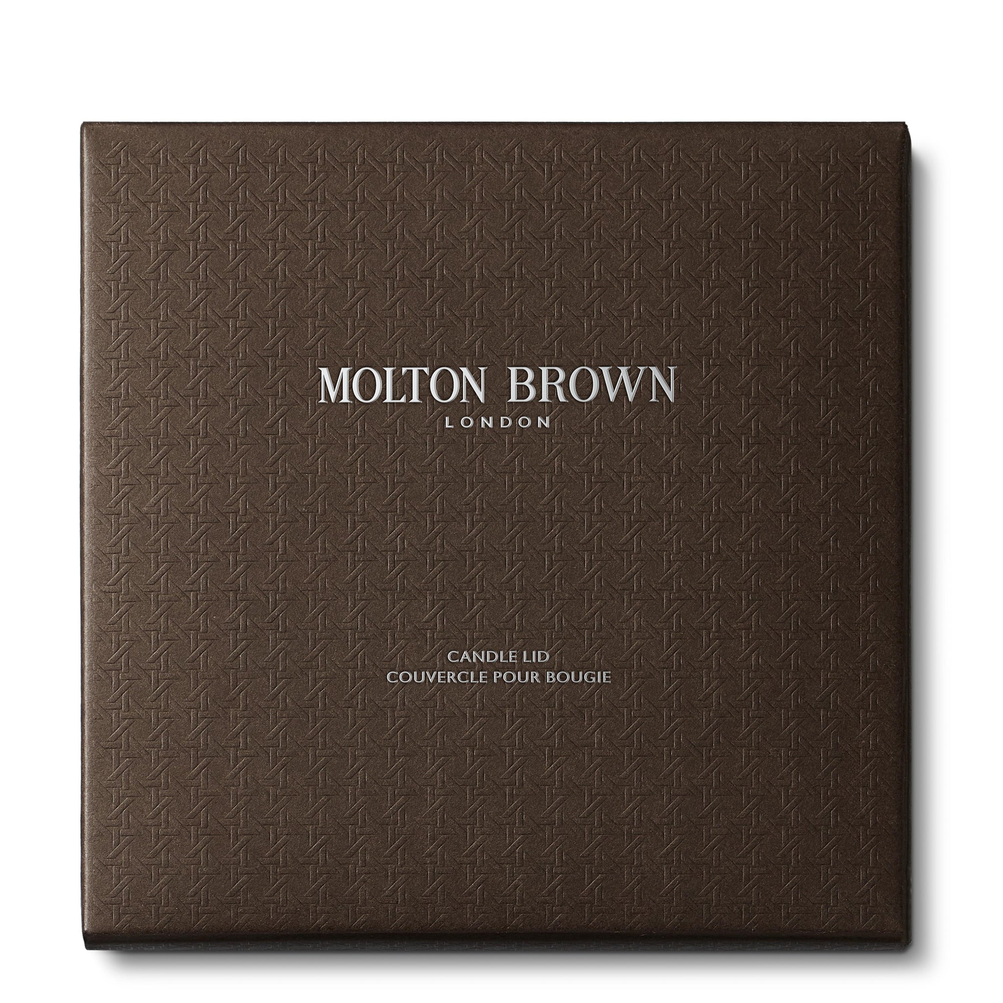 A square, textured dark brown box with MoltonBrown Nederlands in silver at the center and Luxury Kaars Lid 154g below—a perfect kaarsaccessoire for any space.