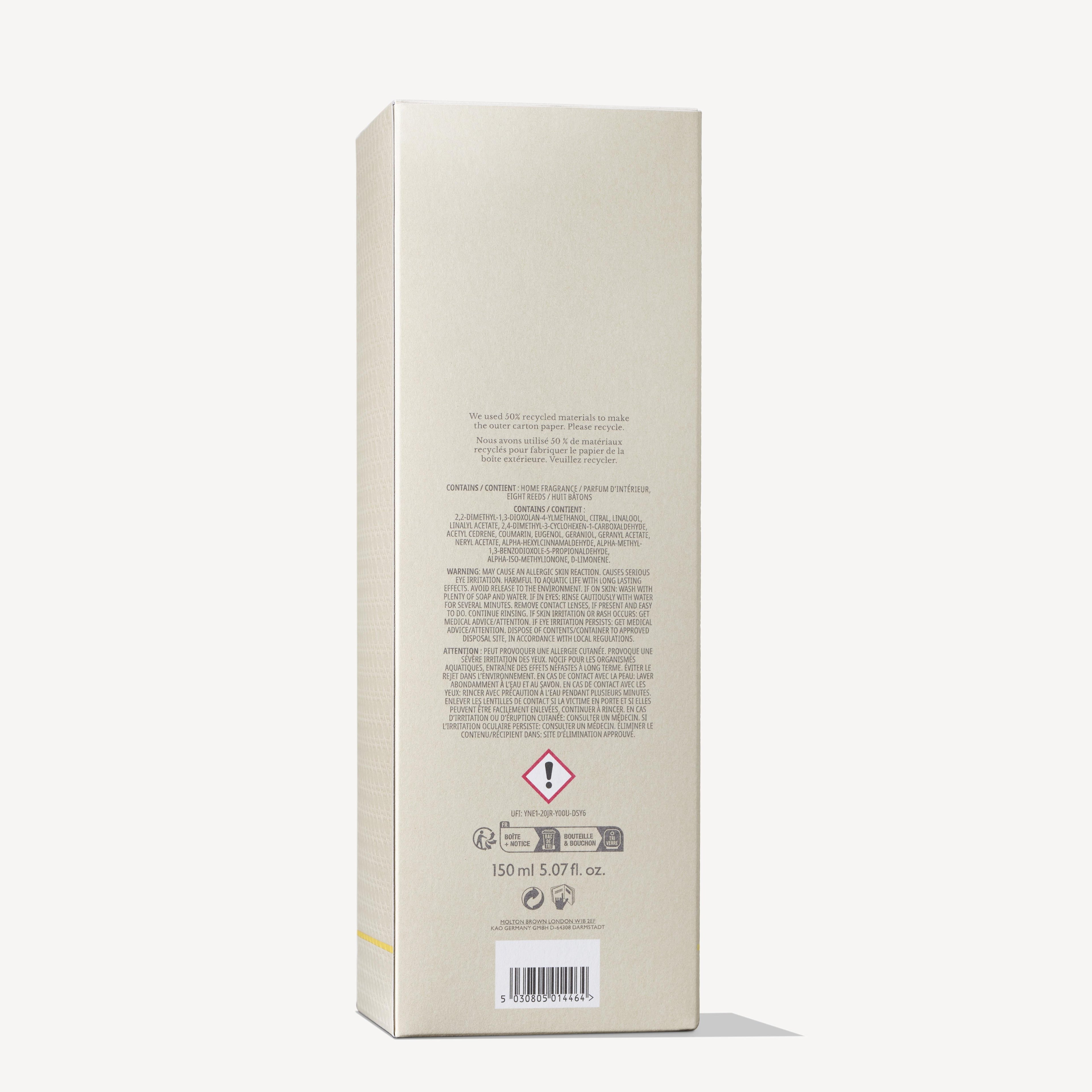 The image shows the back of a beige MoltonBrown Nederlands "test 2 Orange & Bergamot Geurstokjes 150ml (Copy)" box with printed text, safety and recycling symbols, a hazard symbol, and a fresh citrus scent of Orange & Bergamot.