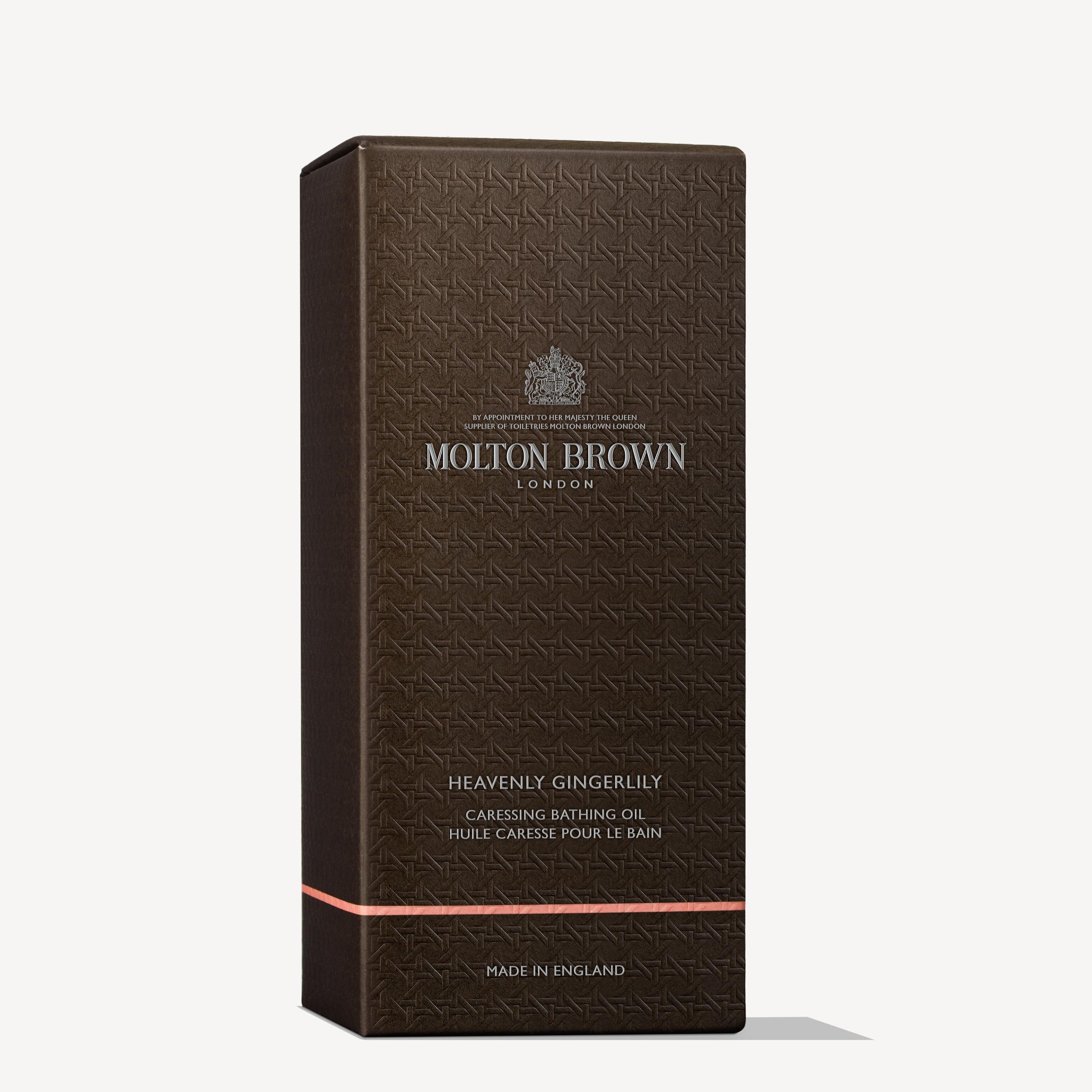 A rectangular, dark brown box of MoltonBrown Nederlands Heavenly Gingerlily Caressing Bathing Oil 200ml features gold text, a subtle pattern, and packaging that notes it is made in England.