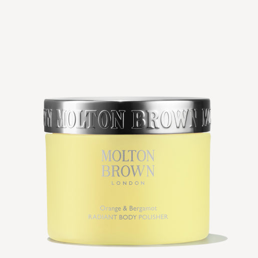 A yellow jar of MoltonBrown Nederlands Orange & Bergamot Radiant Body Polisher 275g with a shiny silver lid is displayed against a plain white background.