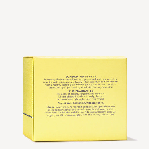 A yellow box describes the MoltonBrown Nederlands Orange & Bergamot Radiant Body Polisher 275g, featuring orange, bergamot, and mandarin notes, plus pairing tips with body oil or suikerkorrels on the back.