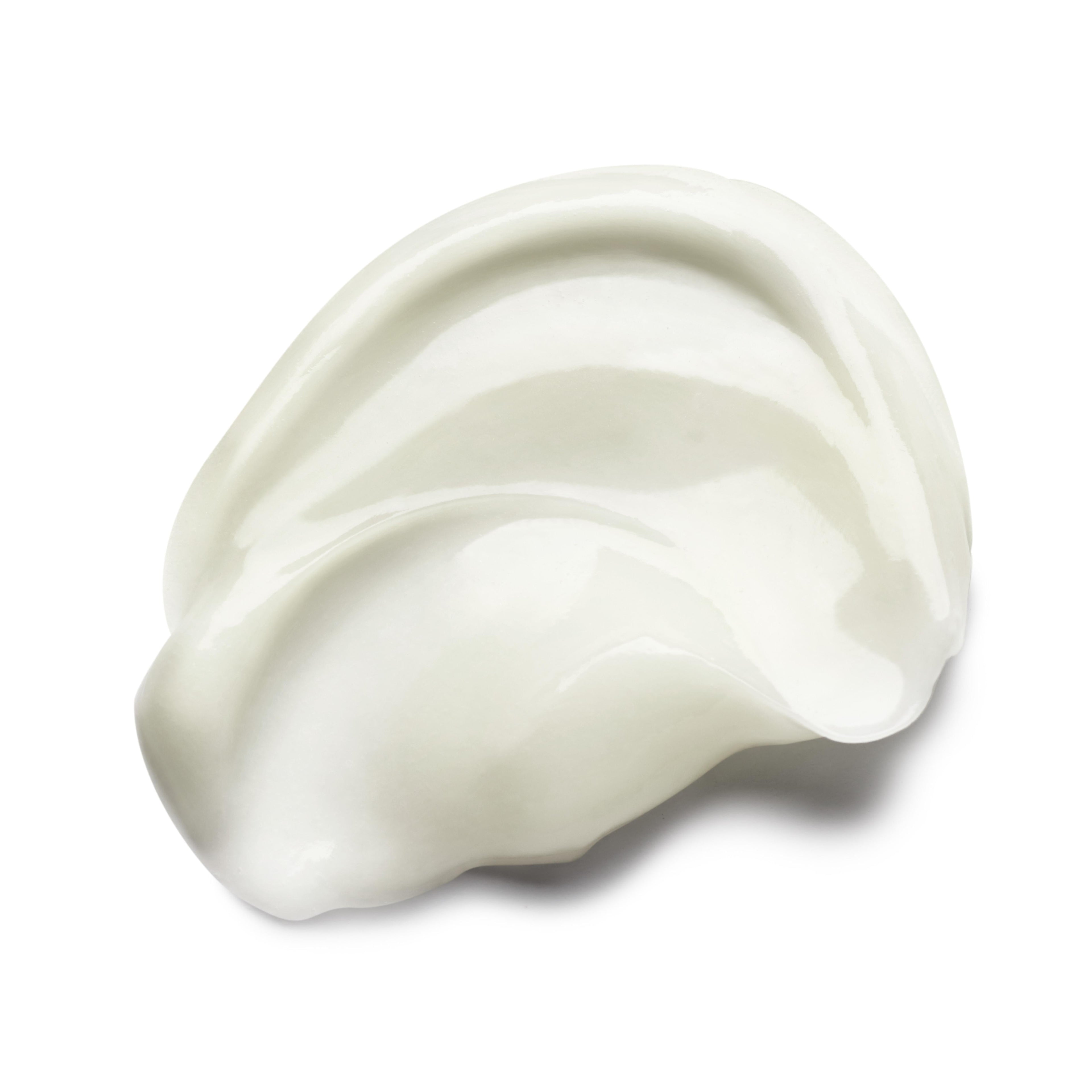 A close-up of MoltonBrown Nederlands Purifying Conditioner With Indian Cress 300ml, showing its white, creamy texture spread smoothly in a curved pattern on a white background.