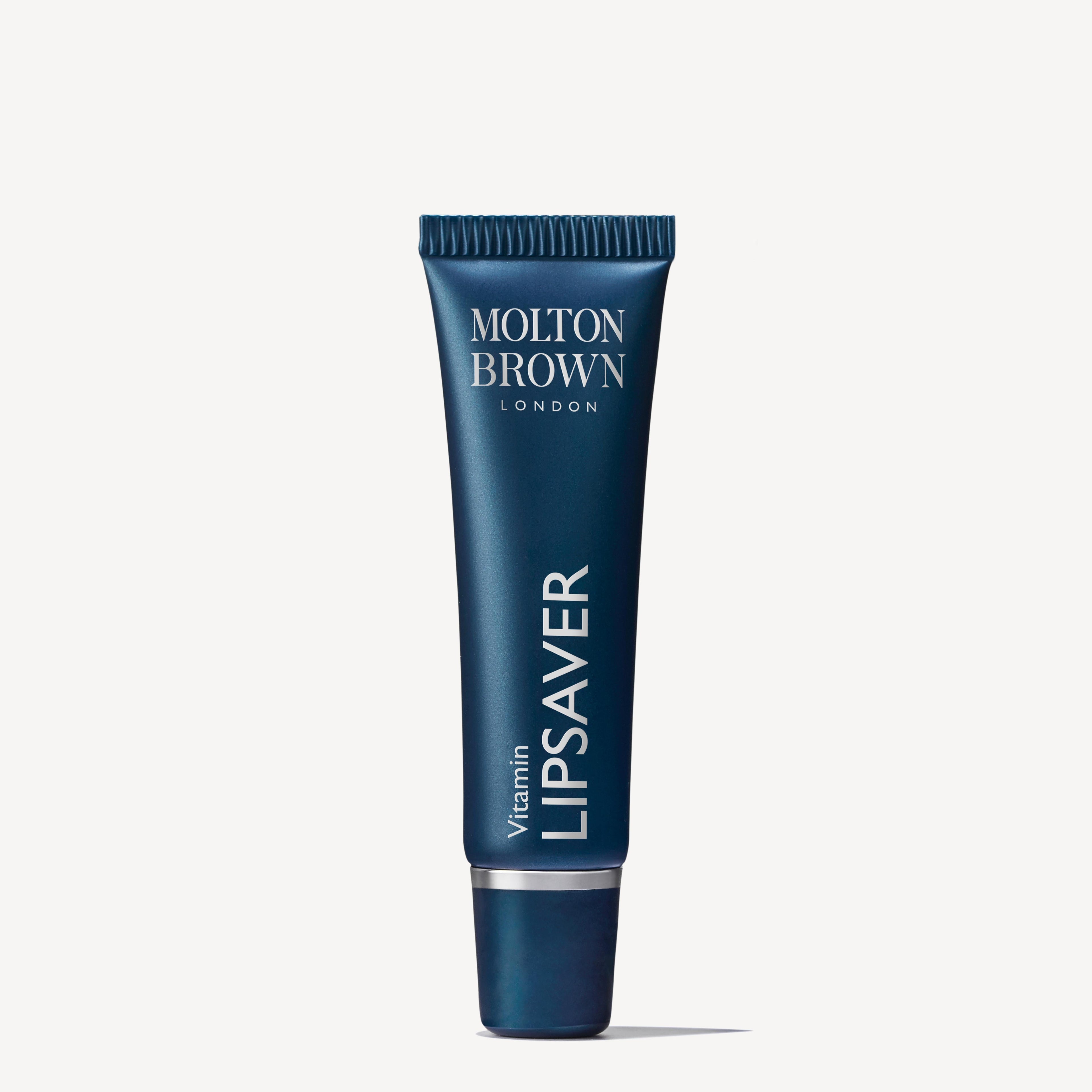 A blue tube of MoltonBrown Nederlands Vitamin Lipsaver 10ml stands upright against a white background, highlighting this vitamin-infused lip balm that helps protect your lips.