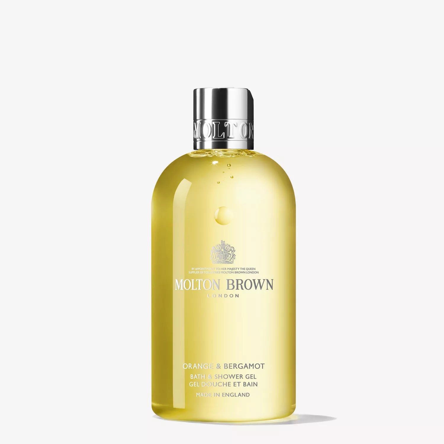A clear bottle of MoltonBrown Nederlands bath & shower gel with a silver cap, filled with yellow liquid. Perfect to pair with their Fiery Pink Pepper Perfumed Soap 150g. The label features brand and product details in white and gold.