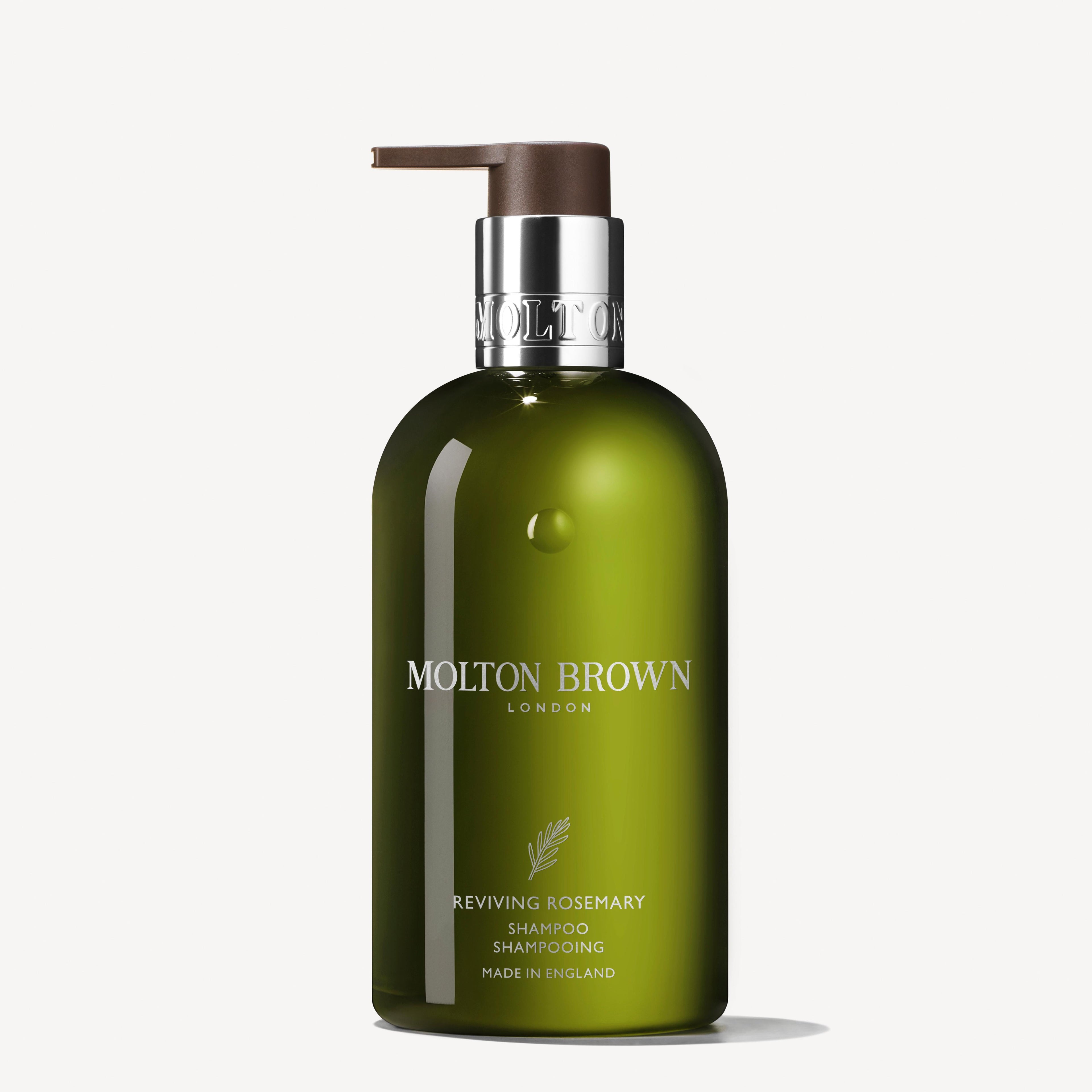 A green bottle of MoltonBrown Nederlands Reviving Rosemary Shampoo with eucalyptus and a pump dispenser stands upright against a white background—perfect as a verzorgende shampoo.