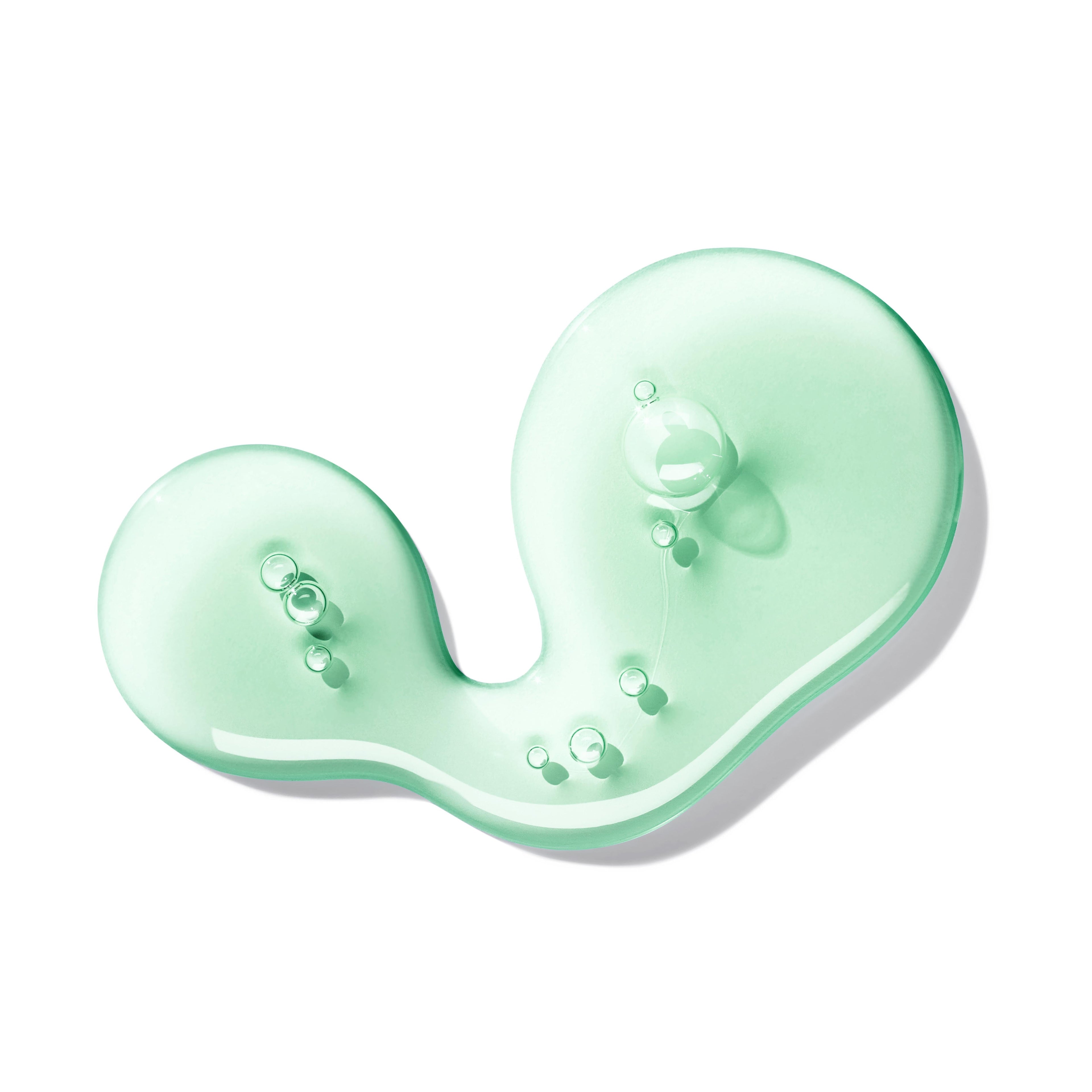 MoltonBrown Nederlands Refined White Mulberry Vloeibare Handzeep 300ml is a translucent, mint-green gel with visible bubbles and an abstract curved form, set against a white background and delicately scented with witte moerbei.