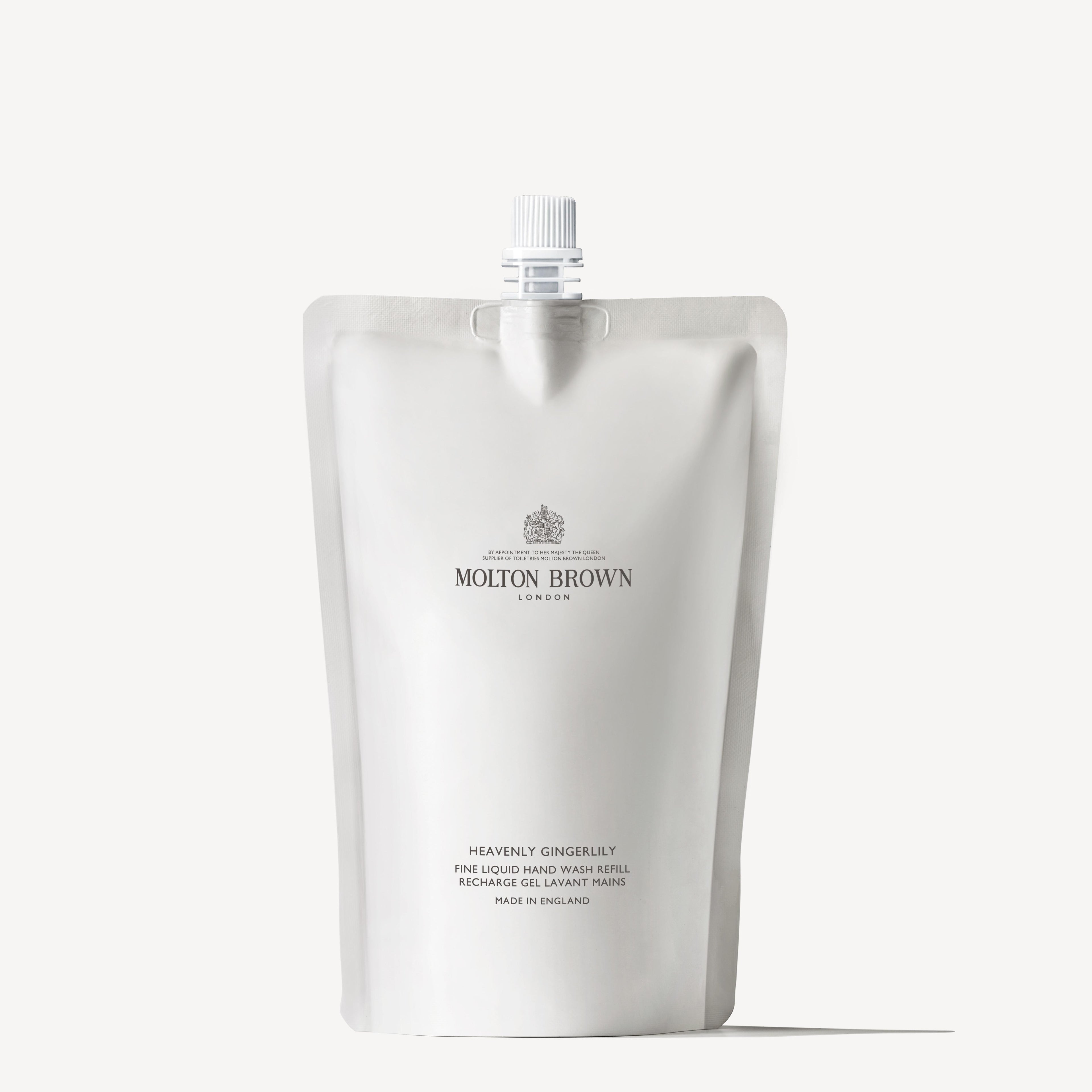 A silver pouch of MoltonBrown Nederlands Heavenly Gingerlily Vloeibare Handzeep Navulling 400ml with a white cap stands upright against a plain white background.
