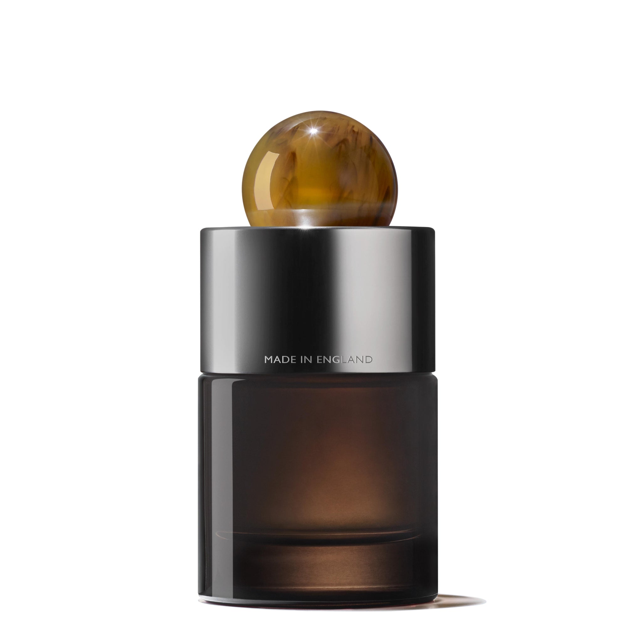 A 100ml bottle of MoltonBrown Nederlands Tobacco Absolute Eau de Parfum, featuring a brown design with a ball-shaped cap.