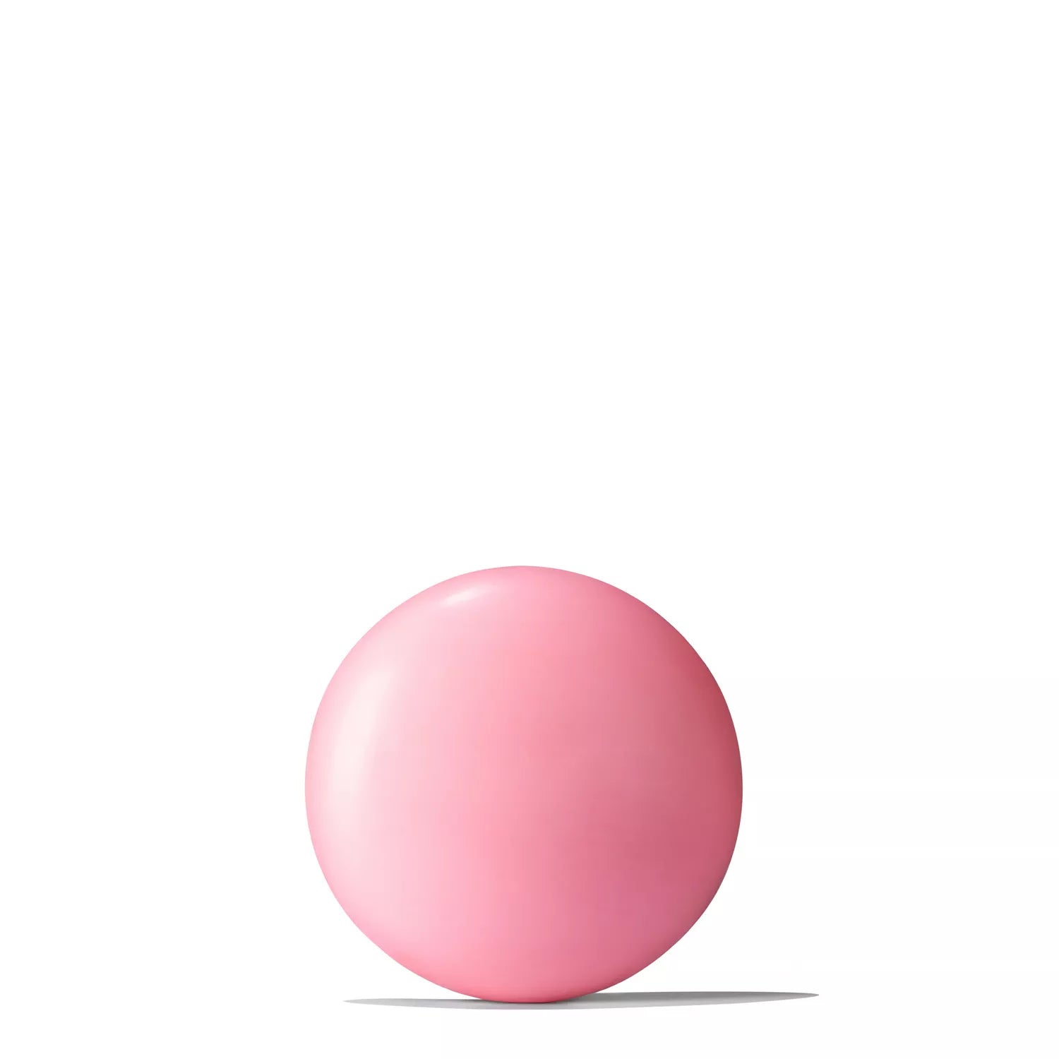 A single round Fiery Pink Pepper Perfumed Soap 150g by MoltonBrown Nederlands rests on a white surface, its pink hue casting a gentle shadow below.