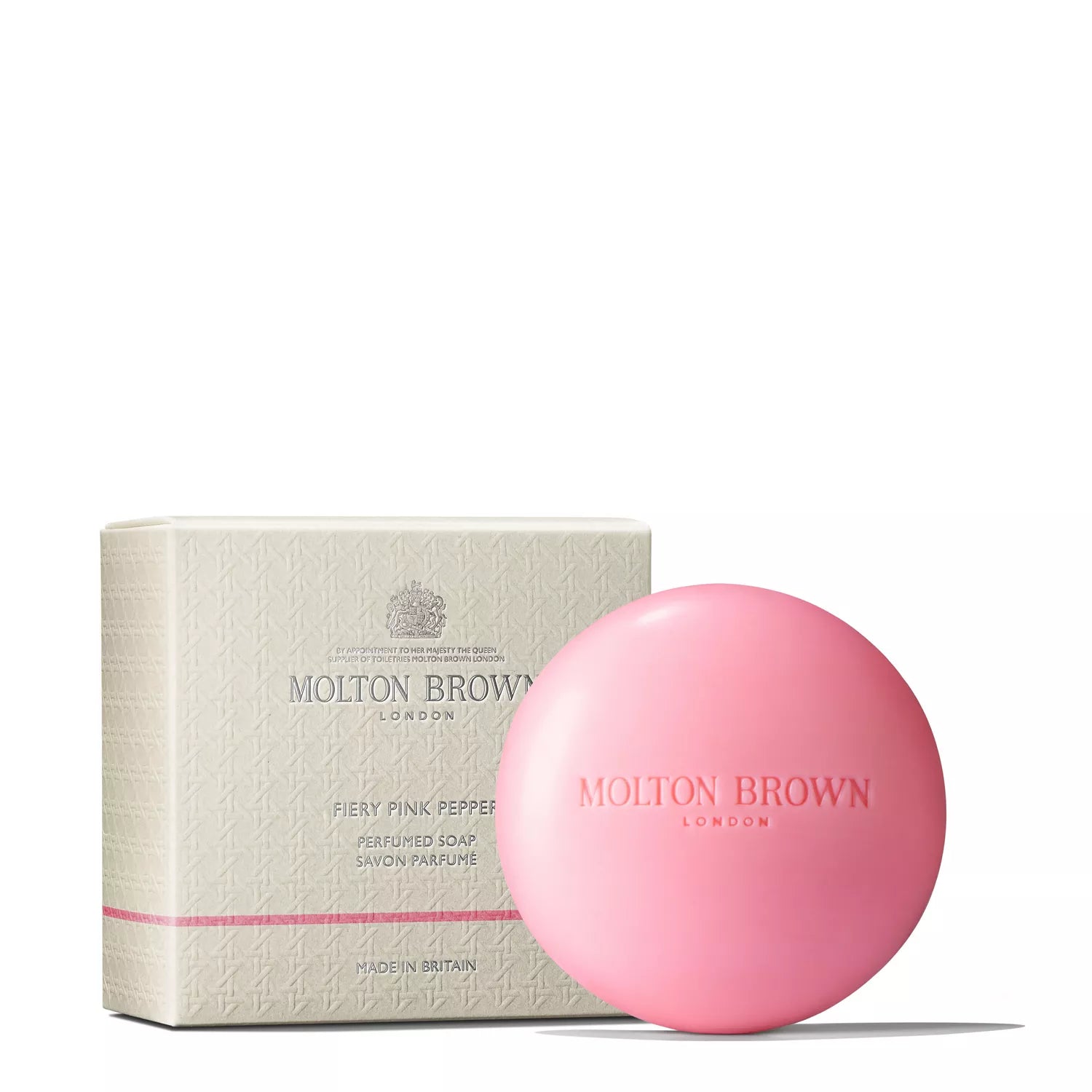 A round, pink MoltonBrown Nederlands Fiery Pink Pepper Perfumed Soap 150g is shown in front of a cream-colored box, both featuring the brand name and product title.