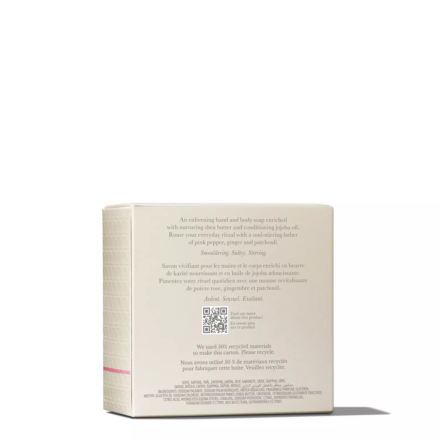 A beige box from MoltonBrown Nederlands with English and French text describes the Fiery Pink Pepper Perfumed Soap 150g made with sheaboter and jojoba oil. The packaging has a QR code, recycling info, and a pink stripe along the side.