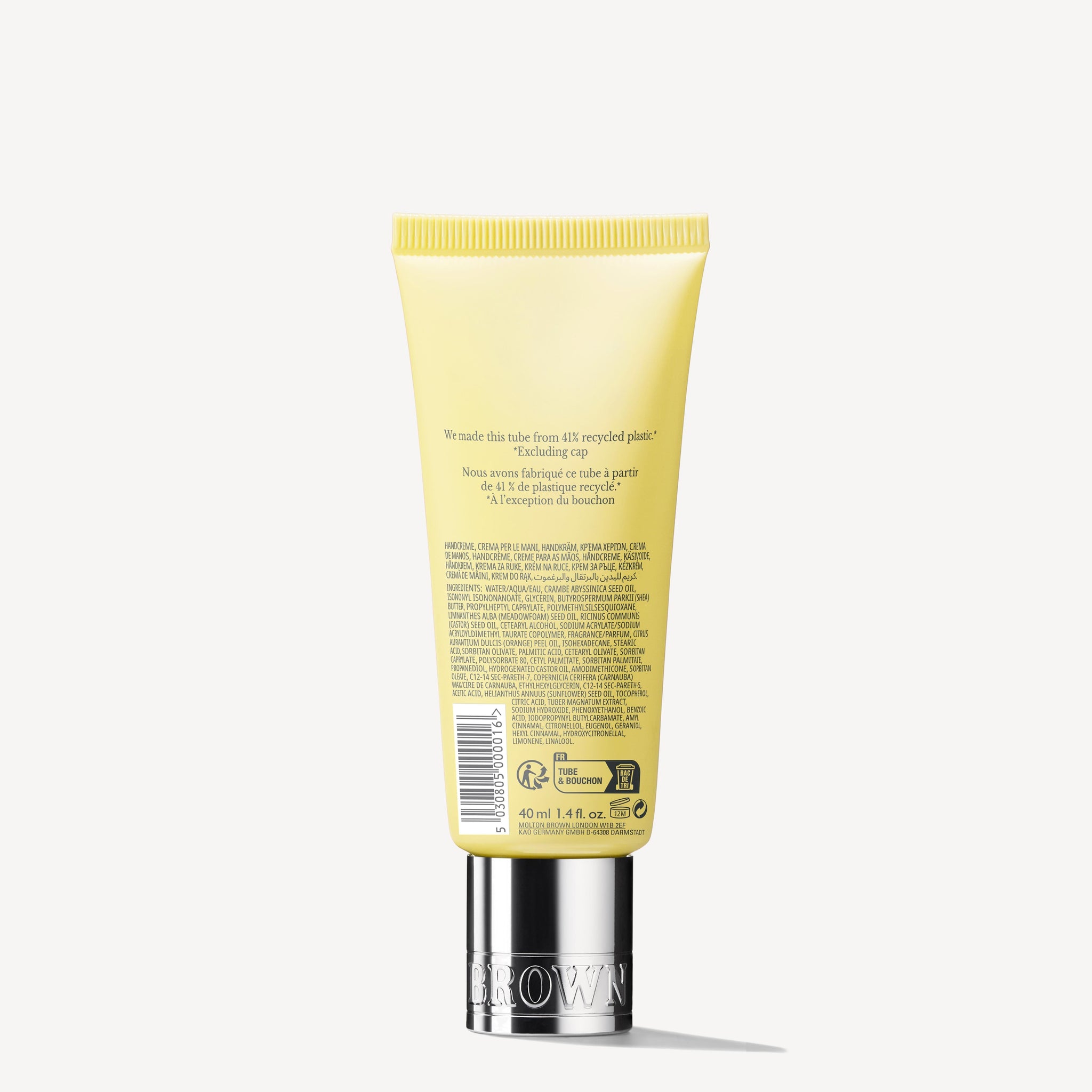 A 40ml yellow tube of MoltonBrown Nederlands Orange & Bergamot Handcrème stands upright with a silver cap. The bilingual label lists details and ingredients, including Orange & Bergamot extracts, and notes the recycled plastic packaging.