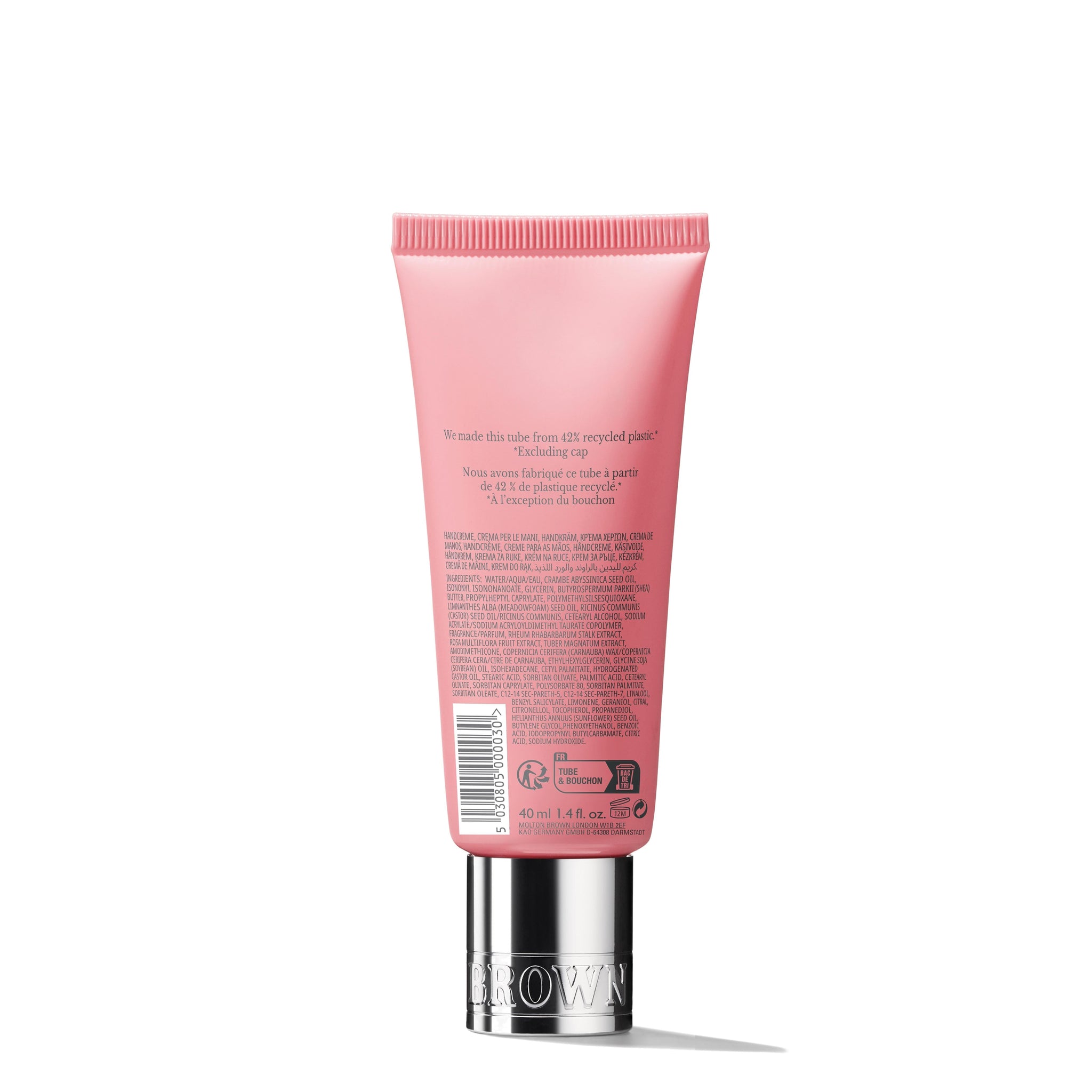 MoltonBrown Nederlands Delicious Rhubarb & Rose Handcrème 40ml comes in a pink tube with a metallic cap, featuring sheaboter to relieve droge handen. Product info and ingredients appear in small text. The upright tube is shown on a white background.